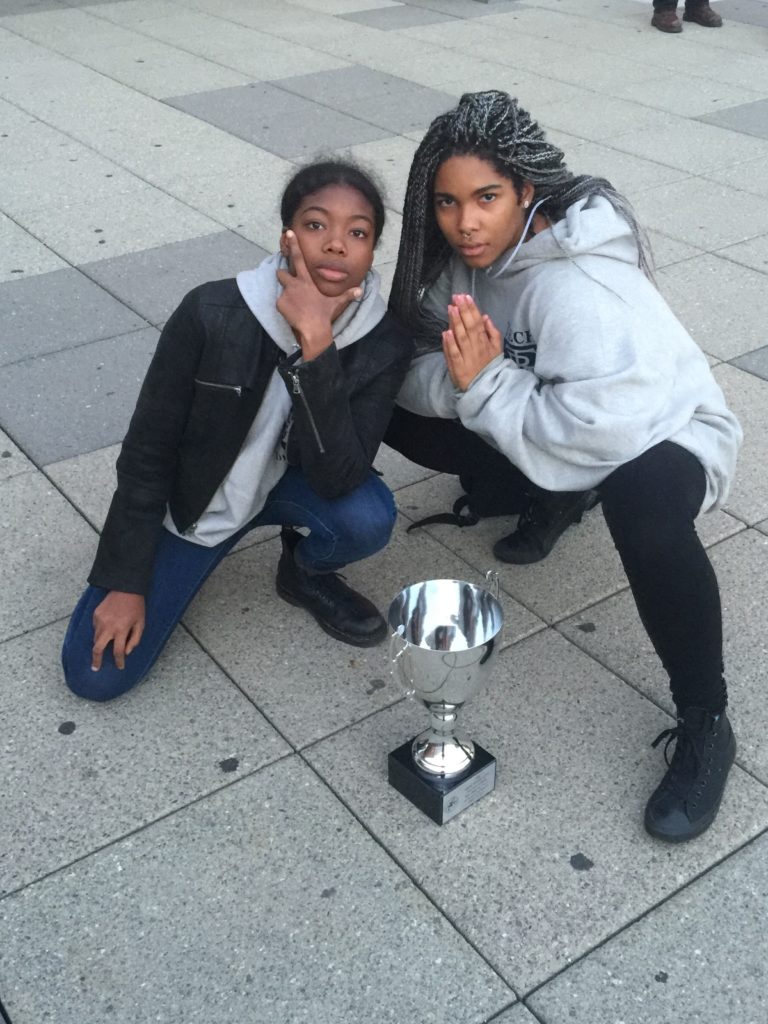 2 girls with trophy