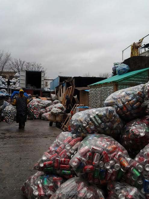 A collection of cans in plastic bags