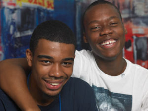 Two more teens smiling