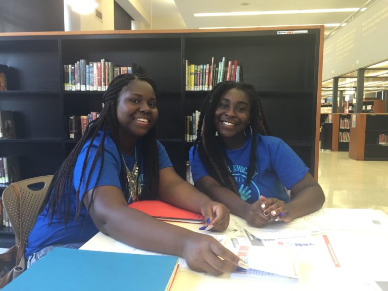 two girls in a library