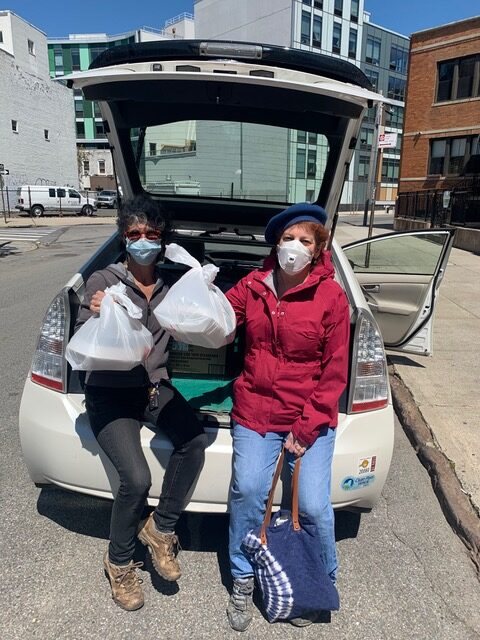 Two volunteers helping at food drive